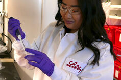 An IU student works in a lab at Eli Lilly and Company.